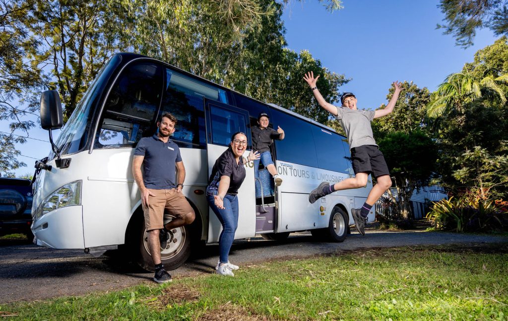 SunnyKids staff and local children with the new SunnyKids outreach bus on the Sunshine Coast supporting mentoring and wellbeing programs.