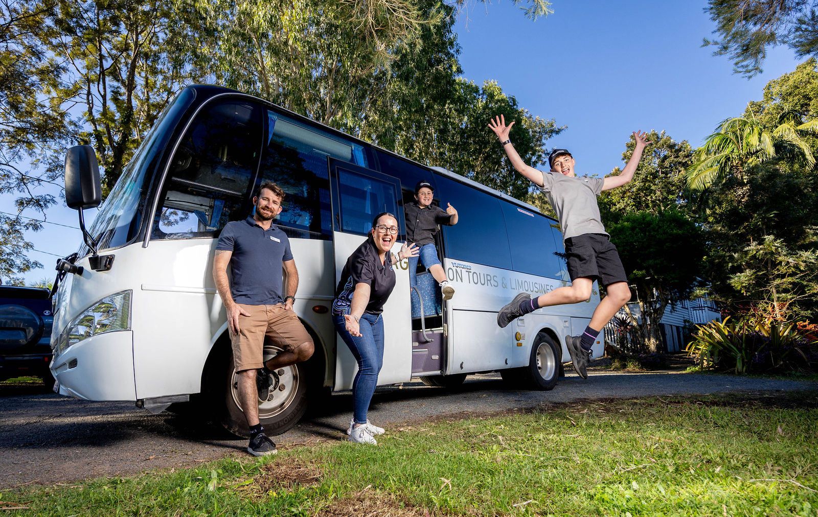 SunnyKids staff and local children with the new SunnyKids outreach bus on the Sunshine Coast supporting mentoring and wellbeing programs.