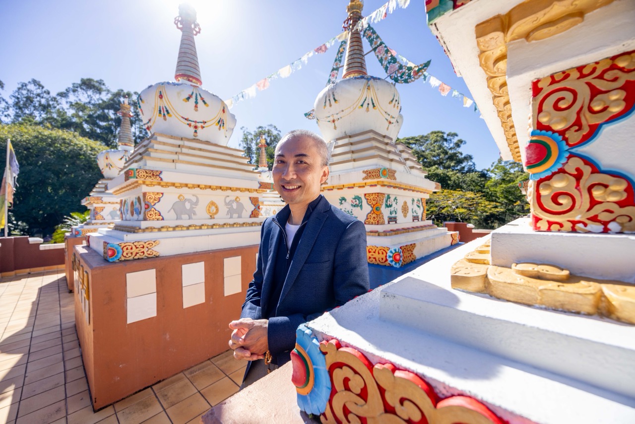 Calvin Yu at Chenrezig Institute ahead of Big Love Festival 2026 on the Sunshine Coast.