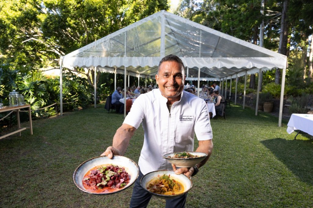 The Curated Plate Culinary Director Peter Kuruvita serves dishes at the opening Island Fire event on the Sunshine Coast.